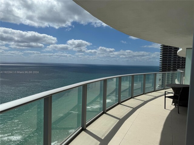 balcony featuring a water view