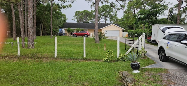 view of yard featuring a garage