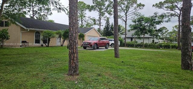 view of yard featuring a garage