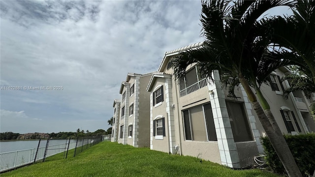 view of building exterior featuring a water view