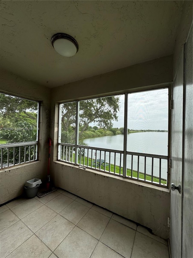 2831 N Oakland Forest Dr Unit 201, Oakland Park, FL 33309 - unfurnished sunroom featuring a water view