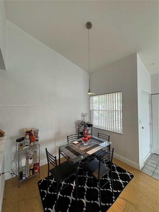 2831 N Oakland Forest Dr Unit 201, Oakland Park, FL 33309 - dining area with wood finished floors and baseboards
