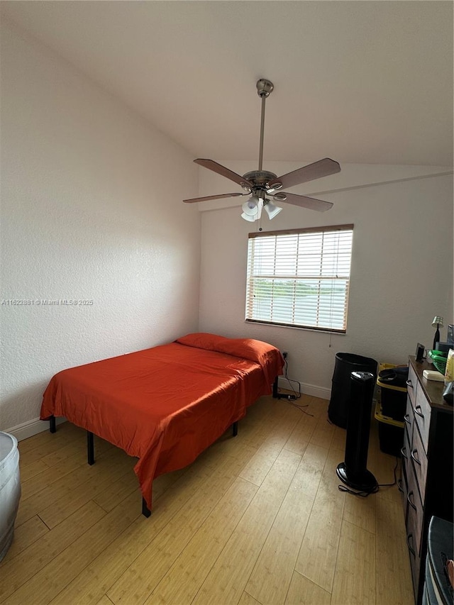 2831 N Oakland Forest Dr Unit 201, Oakland Park, FL 33309 - bedroom featuring light wood finished floors, ceiling fan, and baseboards