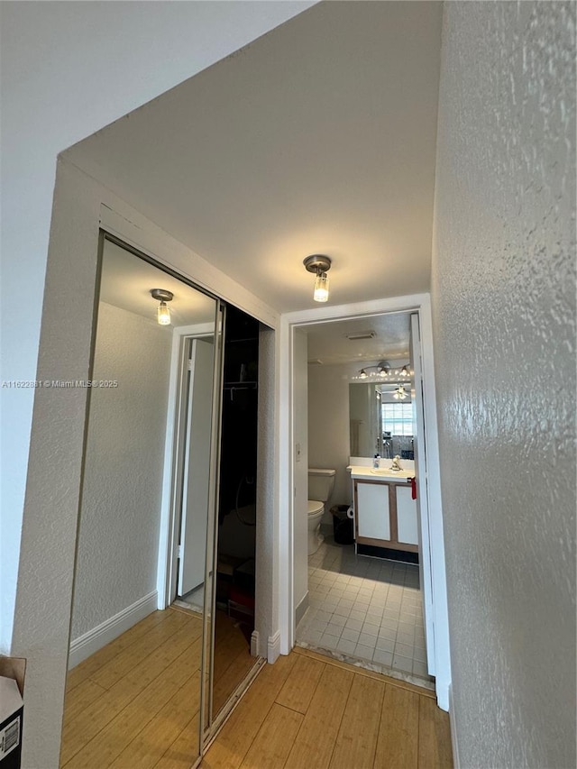 corridor featuring light hardwood / wood-style flooring