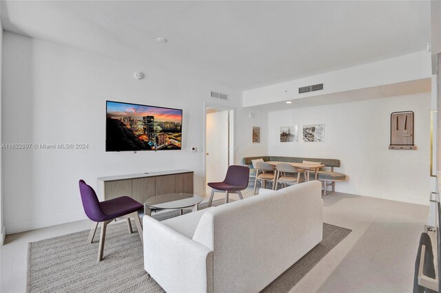 living room featuring light tile patterned floors