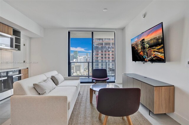 tiled living room featuring expansive windows