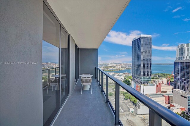 balcony featuring a water view