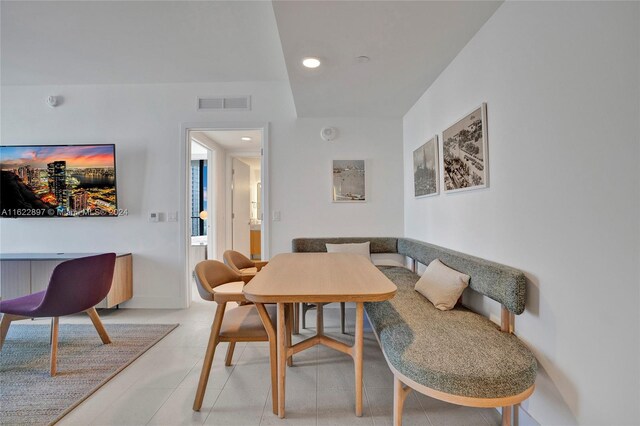 dining space with light tile patterned floors