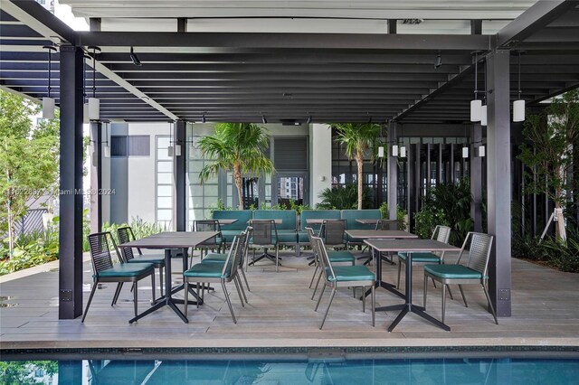 view of swimming pool with a pergola