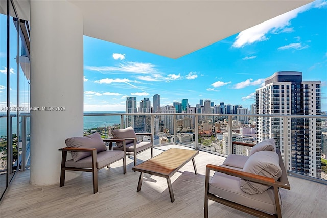 balcony featuring a water view