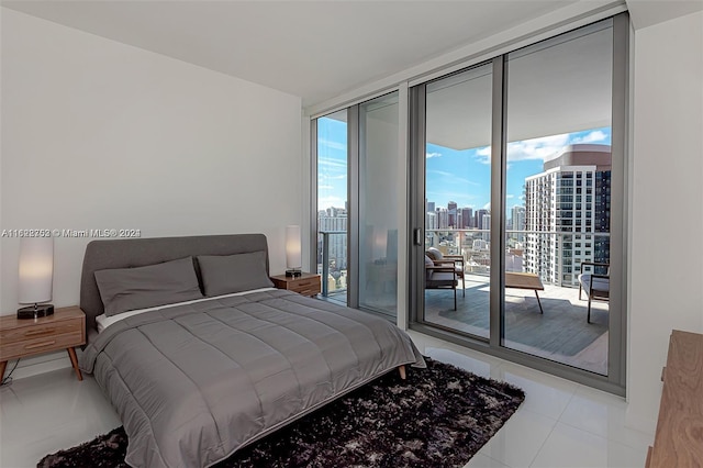 tiled bedroom featuring floor to ceiling windows and access to exterior