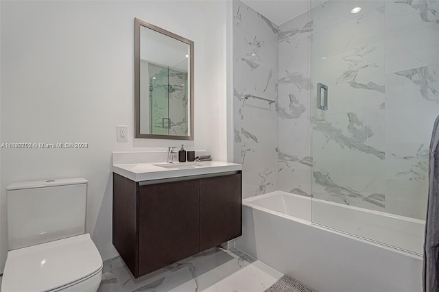 full bathroom featuring vanity, combined bath / shower with glass door, and toilet