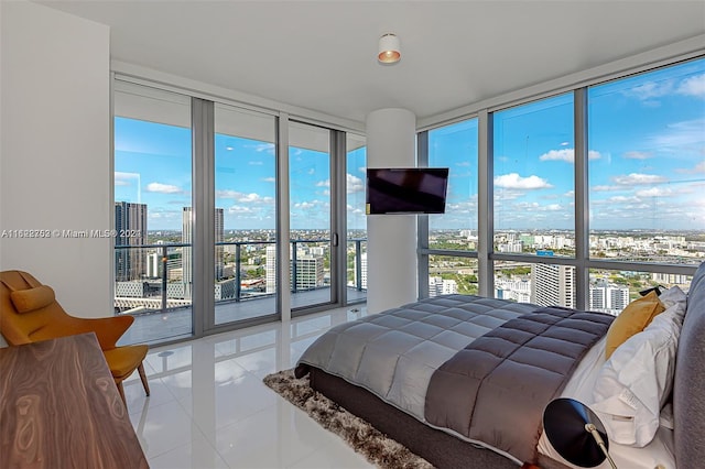 bedroom featuring floor to ceiling windows, light tile patterned floors, and multiple windows