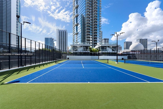 view of sport court featuring basketball hoop