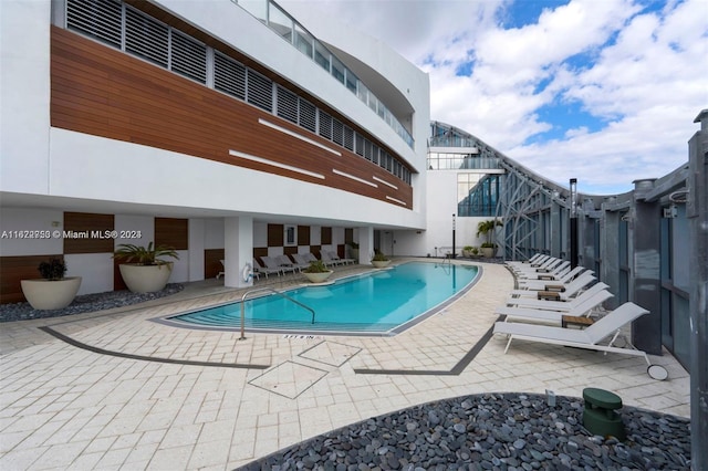 view of pool featuring a patio