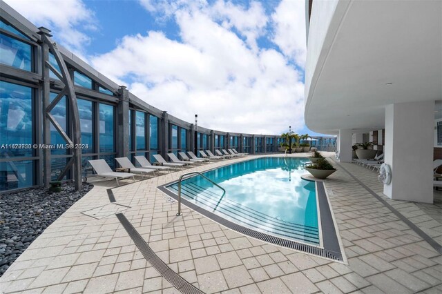 view of pool featuring a patio