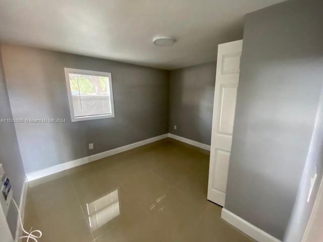 view of tiled spare room