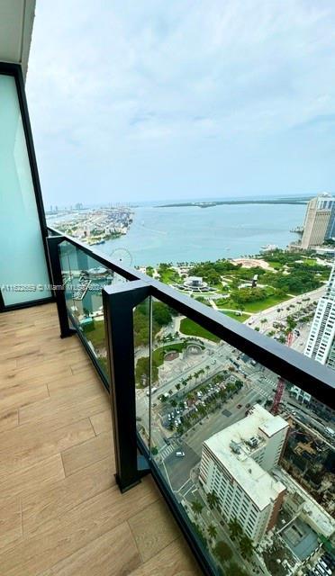 balcony featuring a water view