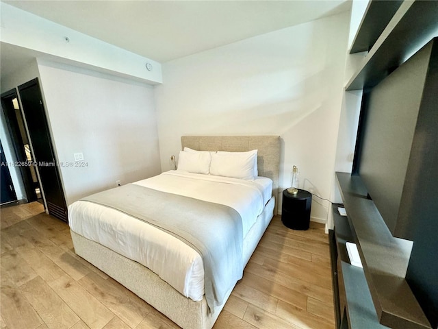 bedroom with light wood-type flooring