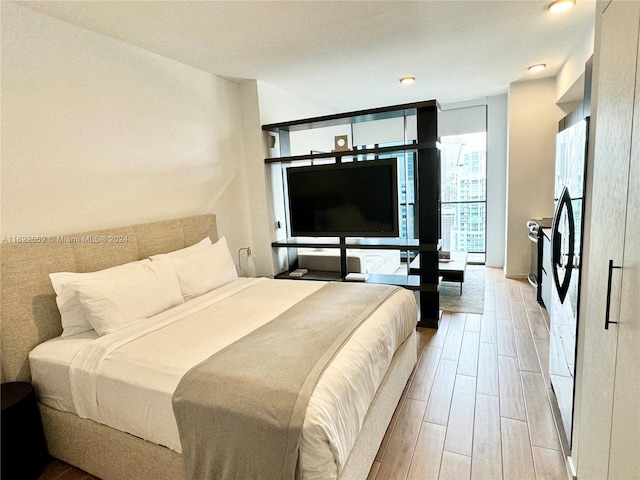 bedroom with floor to ceiling windows