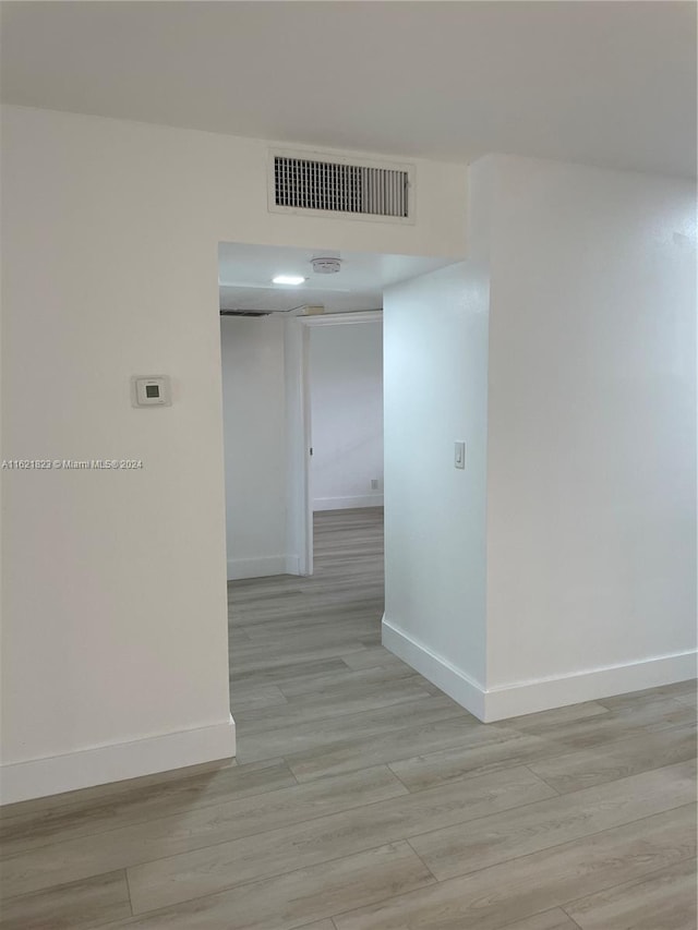 hallway featuring light wood-type flooring