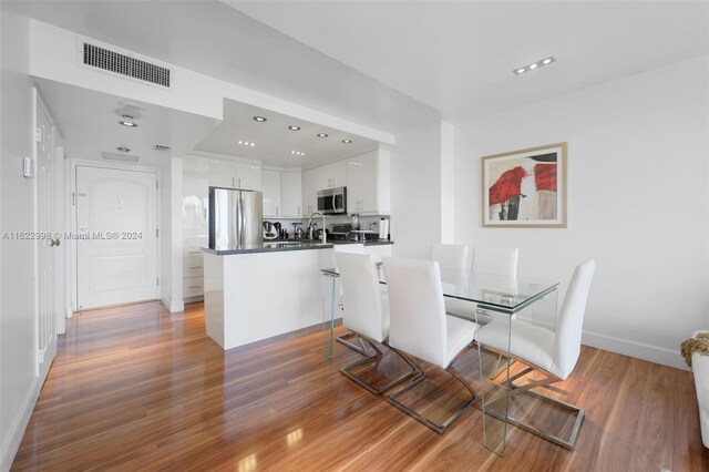 dining space featuring hardwood / wood-style floors