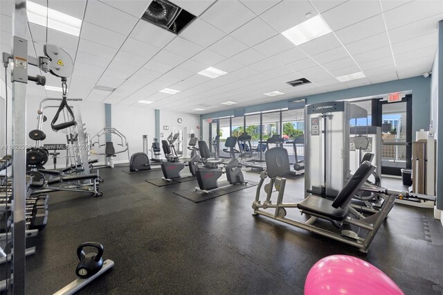 workout area featuring a drop ceiling