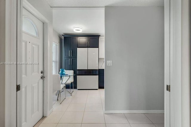 hallway featuring light tile patterned flooring