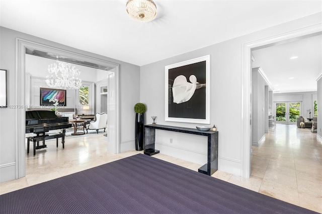 foyer entrance featuring tile patterned floors and an inviting chandelier