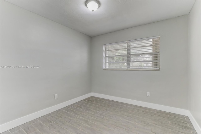 spare room with light hardwood / wood-style flooring