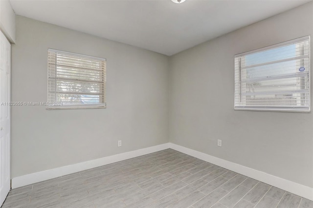 unfurnished room with light hardwood / wood-style floors