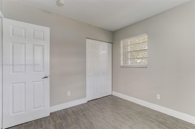 spare room with light hardwood / wood-style floors