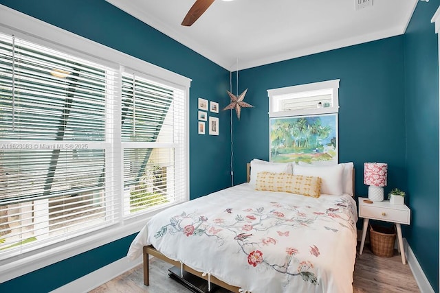 bedroom featuring ceiling fan and hardwood / wood-style flooring