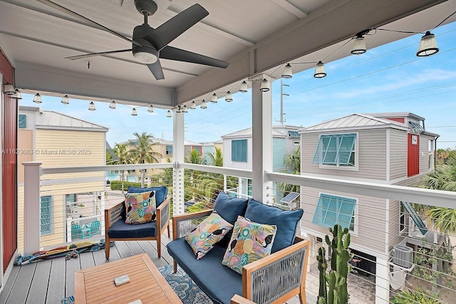 balcony featuring cooling unit and ceiling fan