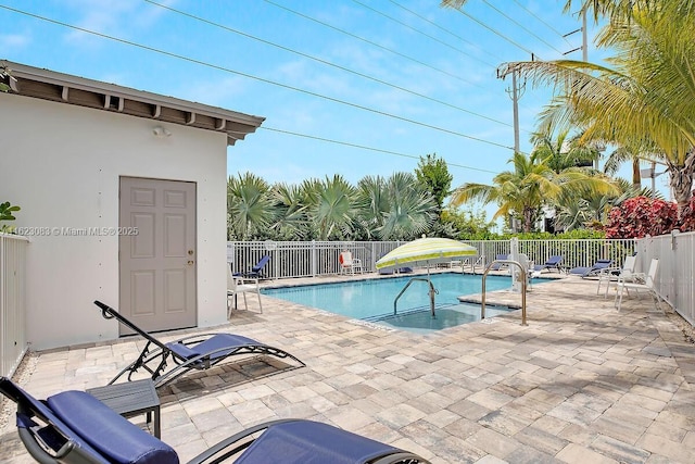 view of swimming pool featuring a patio