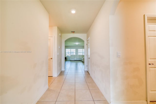 hallway featuring light tile patterned floors