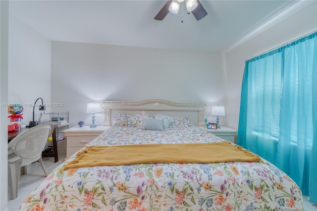 bedroom featuring light tile patterned flooring and a ceiling fan