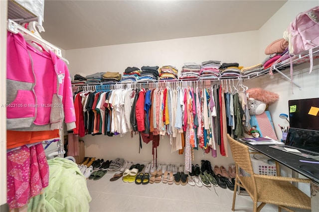 spacious closet with tile patterned floors