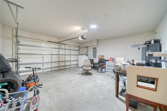 garage with electric panel, washer / clothes dryer, a garage door opener, and concrete block wall