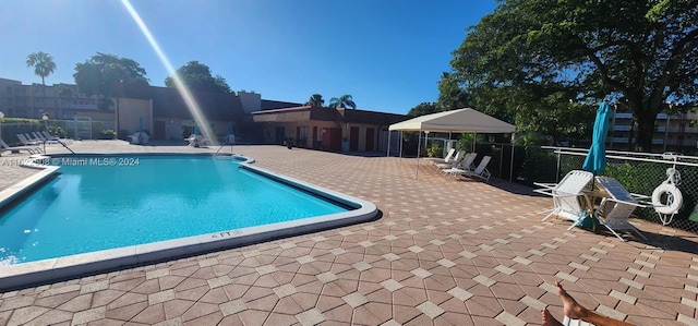 view of pool featuring a patio