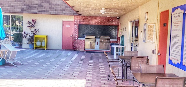 view of patio with grilling area and ceiling fan