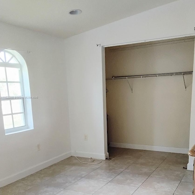 6474 SW 26th St, Miramar, FL 33023 - unfurnished bedroom with multiple windows, a closet, and baseboards