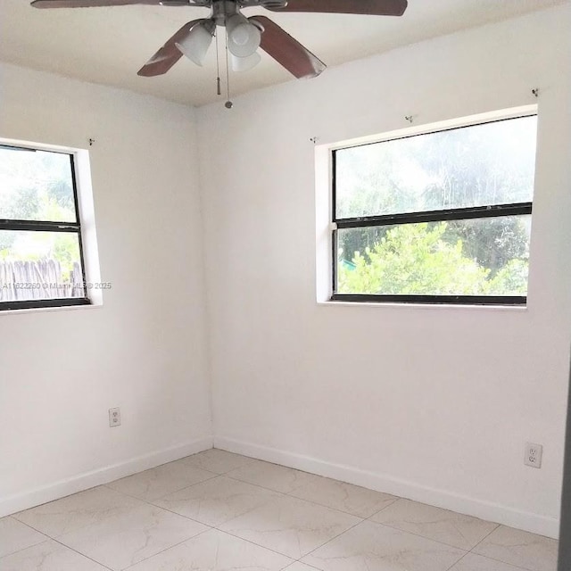 6474 SW 26th St, Miramar, FL 33023 - spare room with ceiling fan, baseboards, and light marble finish floors