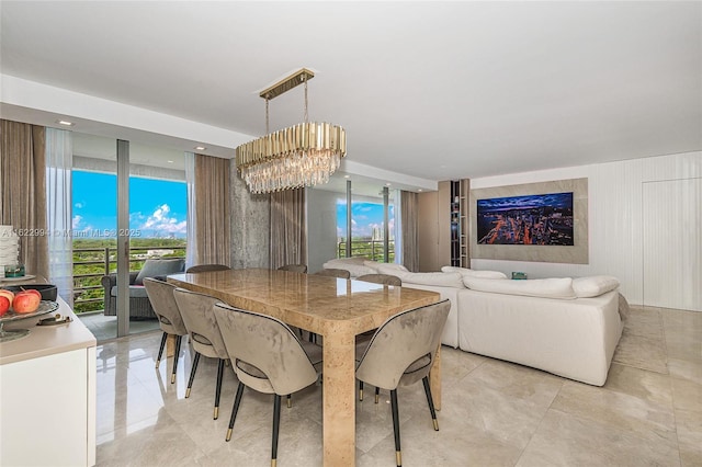 dining room with a chandelier and floor to ceiling windows