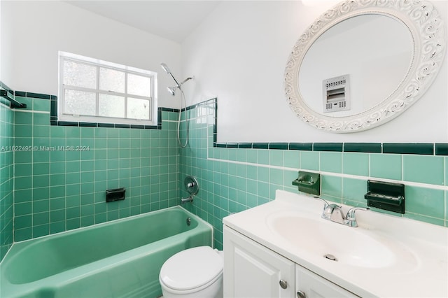 635 8th St Unit 205, Miami Beach, FL 33139 - full bath featuring vanity, shower / bathtub combination, tile walls, and wainscoting