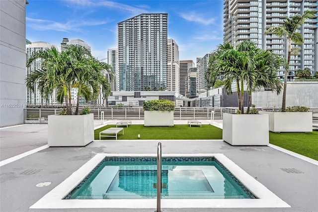 view of pool featuring a patio area and a community hot tub