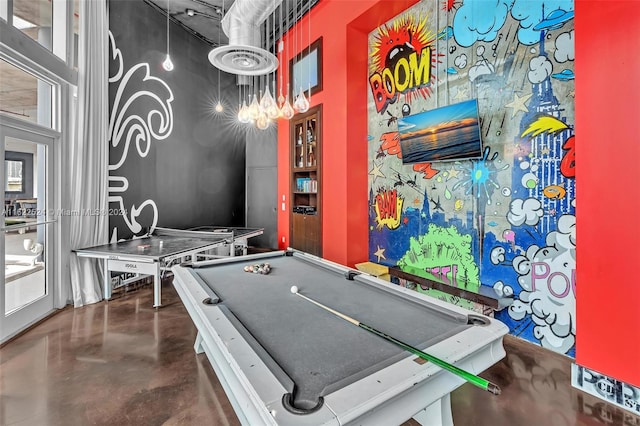 game room with pool table and a high ceiling