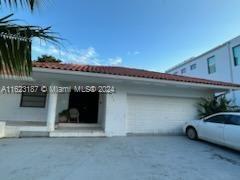 view of side of home featuring a garage