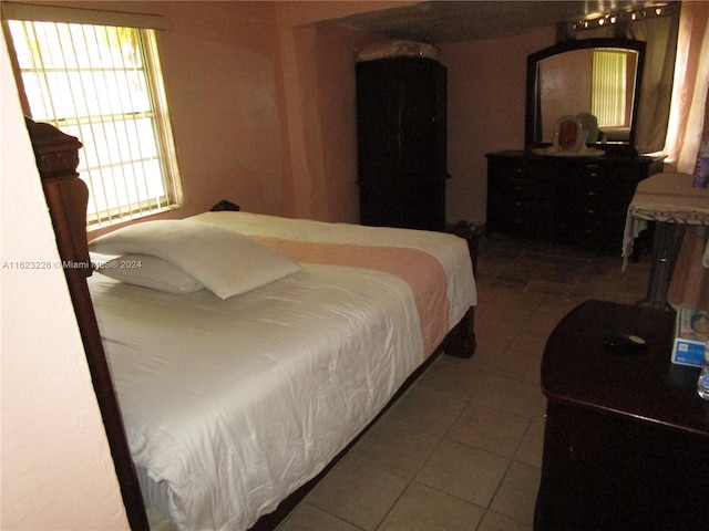 bedroom featuring tile patterned flooring