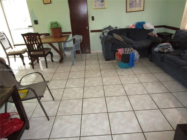 living room with light tile patterned flooring